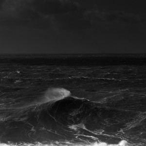 fine art black and white photo of the atlantic ocean during a big swell in Nazarè, Portugal