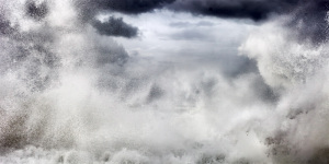 fine art photo of a stormy sea in Italy with a wave forming an abstract pattern with the clouds. Marina di Pisa