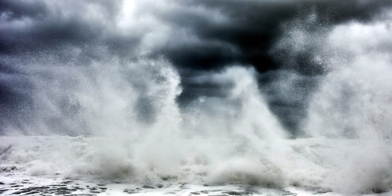 fine art photo of a stormy sea in Italy with a wave forming an abstract pattern with the clouds