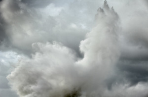 fine art photo of a stormy sea in Italy with a wave forming an abstract pattern with the clouds. Marina di Pisa