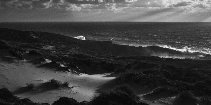 Praia do Malhào, in Alentejo Portugal. Fine art photo in black and white of a stormy ocean