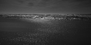 finer black and white photograph of a beach named Praia do Malhào in Portugal