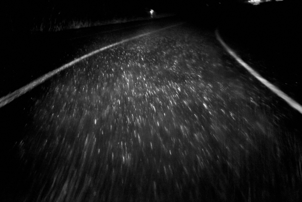 fine art black and white image of hard rain taken while driving a motorhome in Portugal on the way to Nazarè