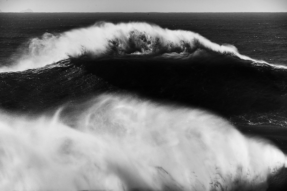 fine art black and white photo of a huge wave in Nazaré, Portugal during winter 2016