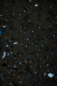 thousands of micro plastic left on the beach by the last big swell